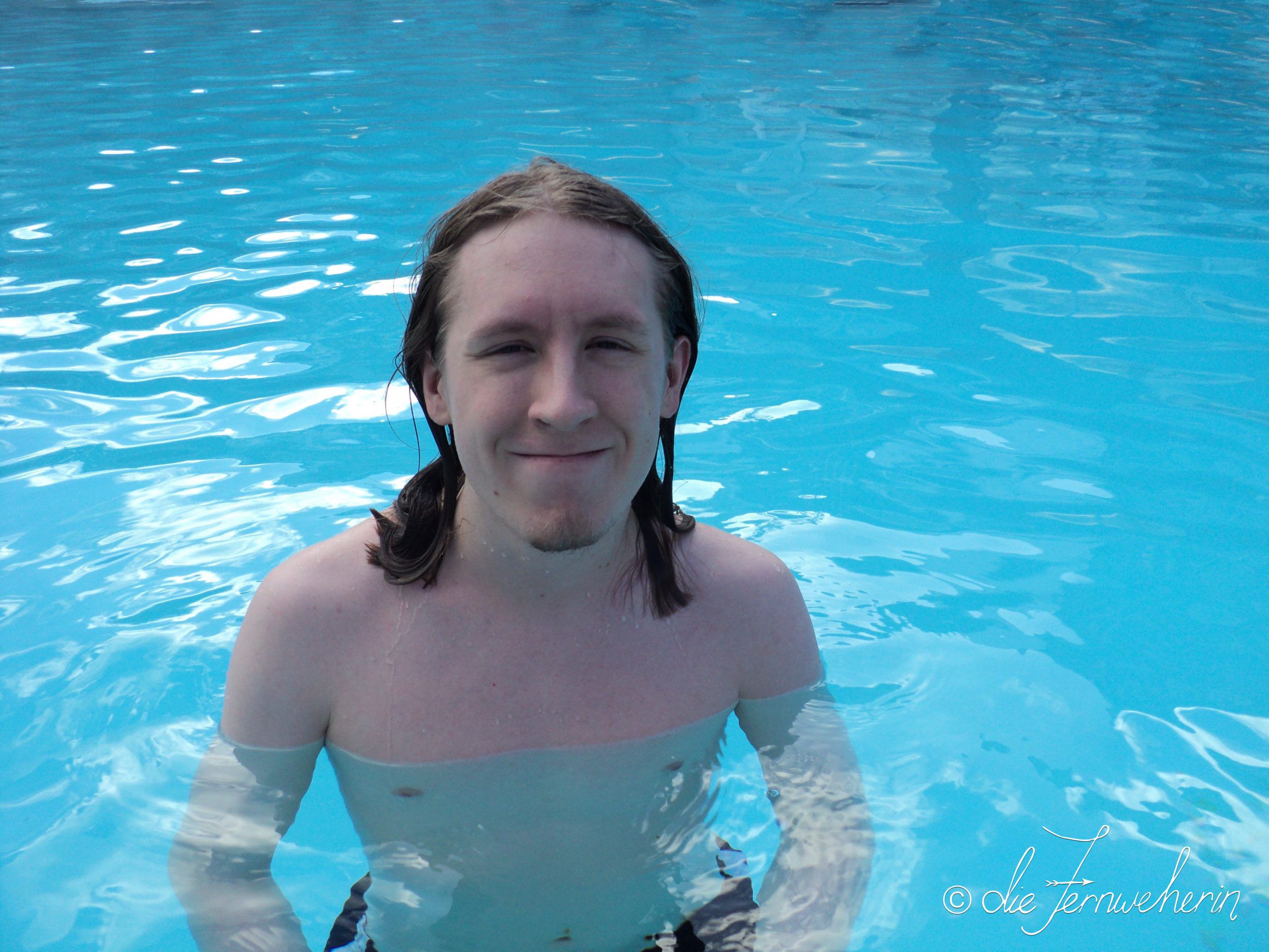 A man relaxes in the Banff Upper Hot Springs.