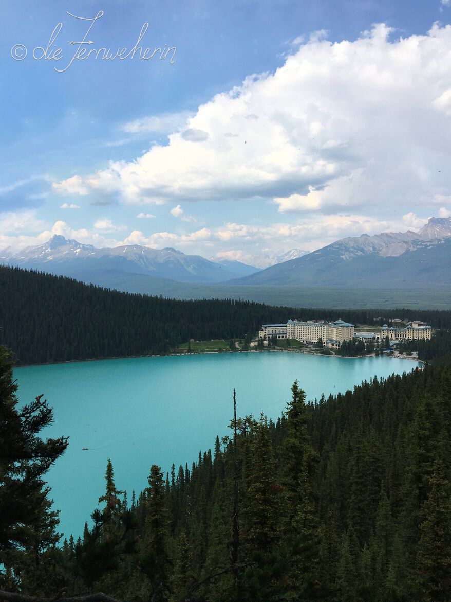 Turquoise blue Lake Louise & the Fairmont hotel as seen from the Fairview Lookout Trail.