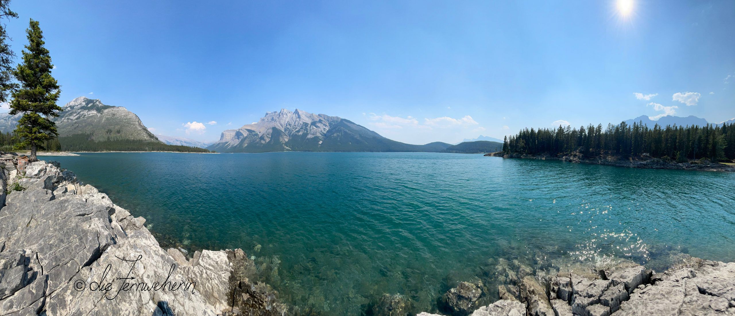 Beautiful greenish-blue Lake Minnewanka in Banff National Park.