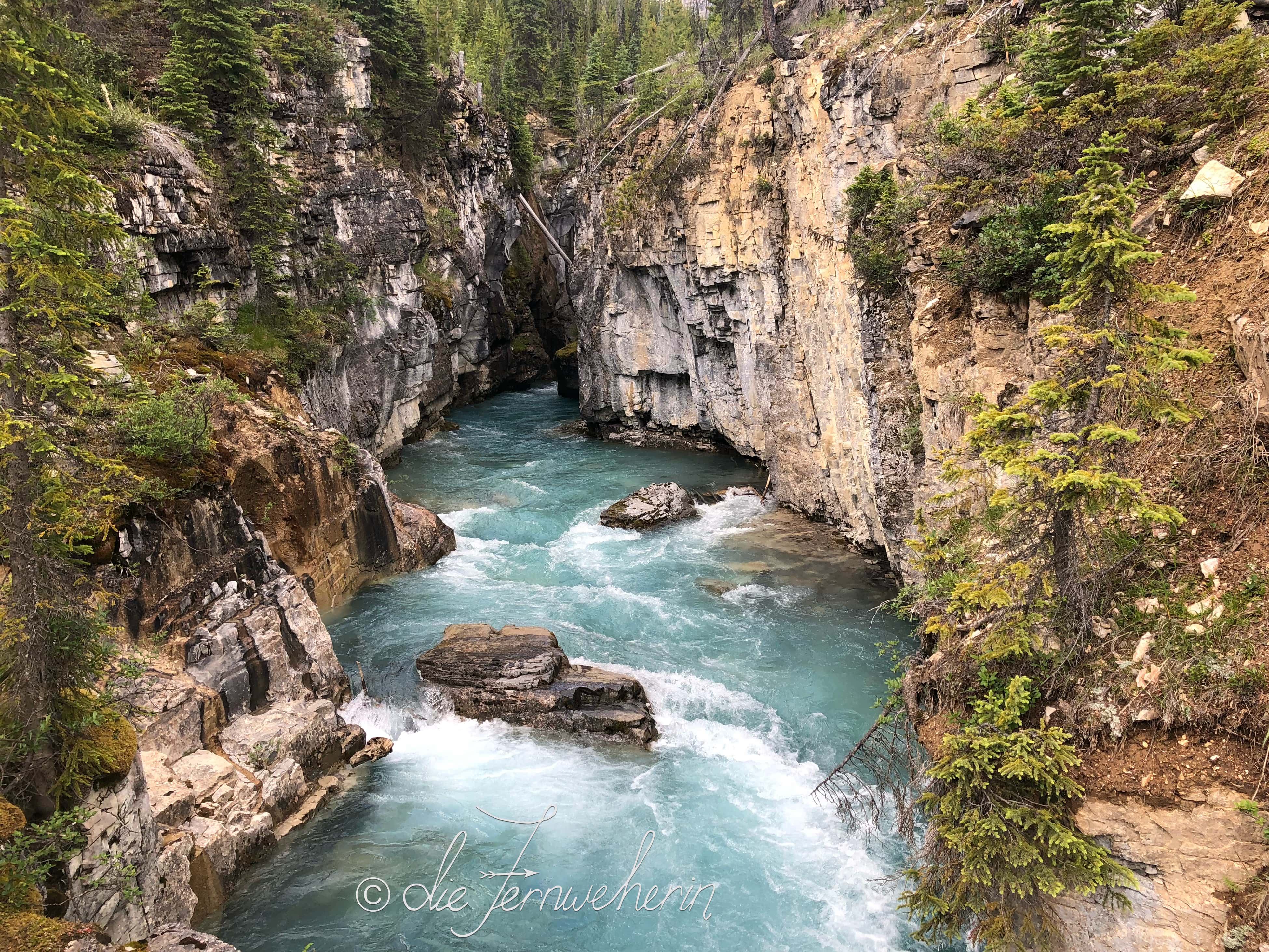 The blue-green waters and rugged walls of Marble Canyon in Kootenay National Park.