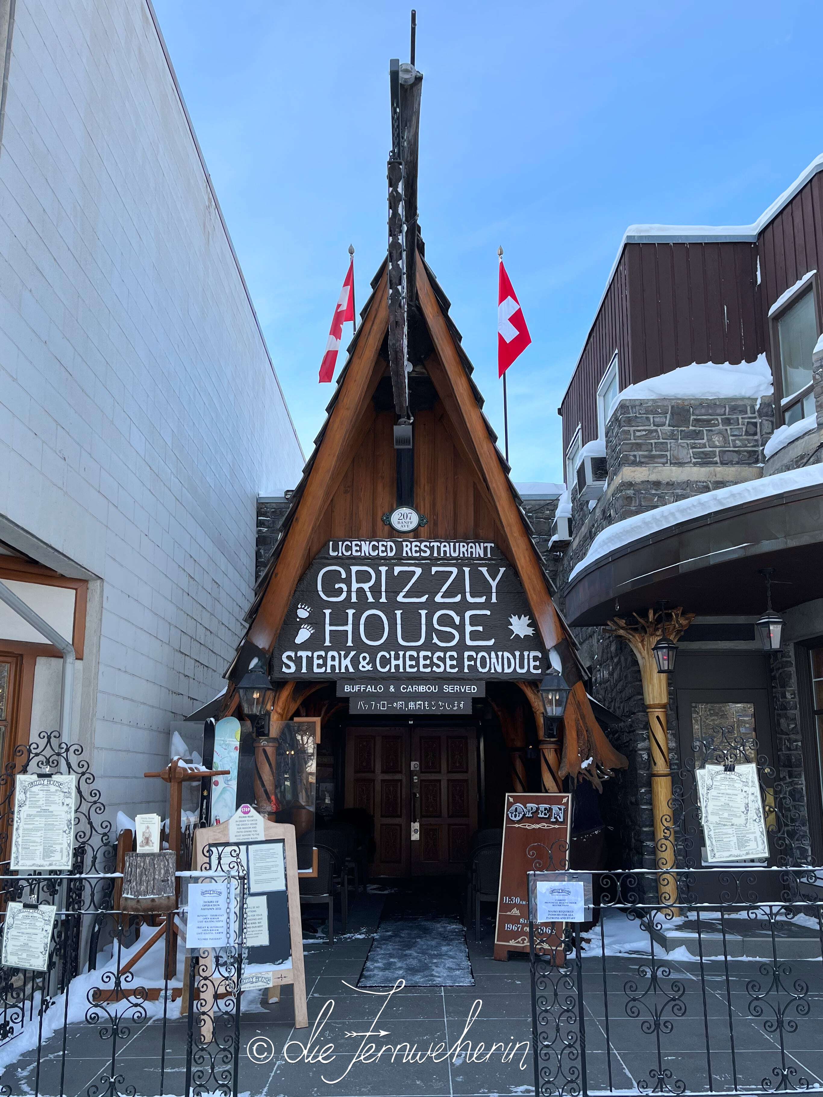 Exterior view of Grizzly House, a restaurant in the town of Banff.
