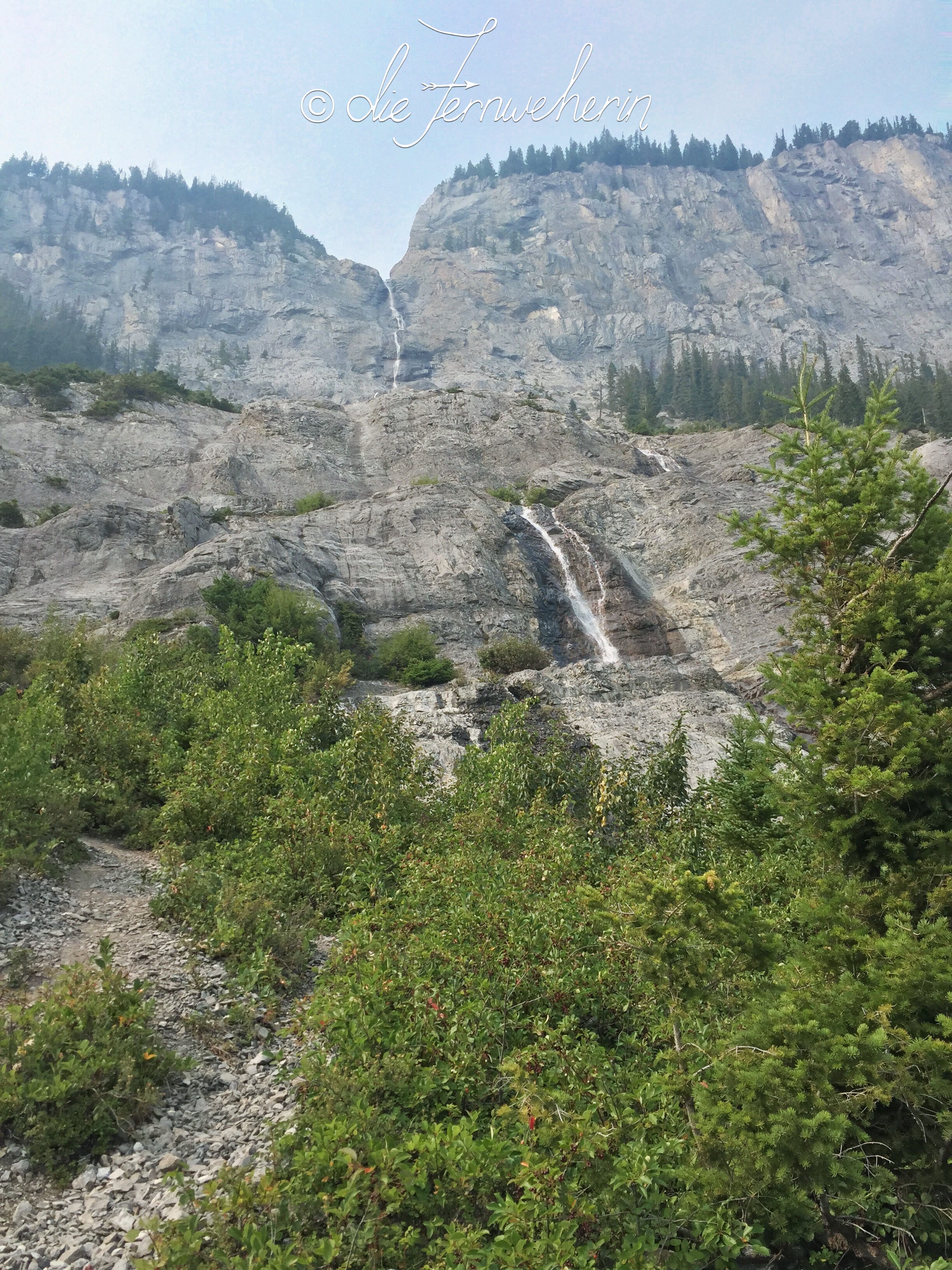 View of Cascade Falls in Banff National Park from the bottom up.