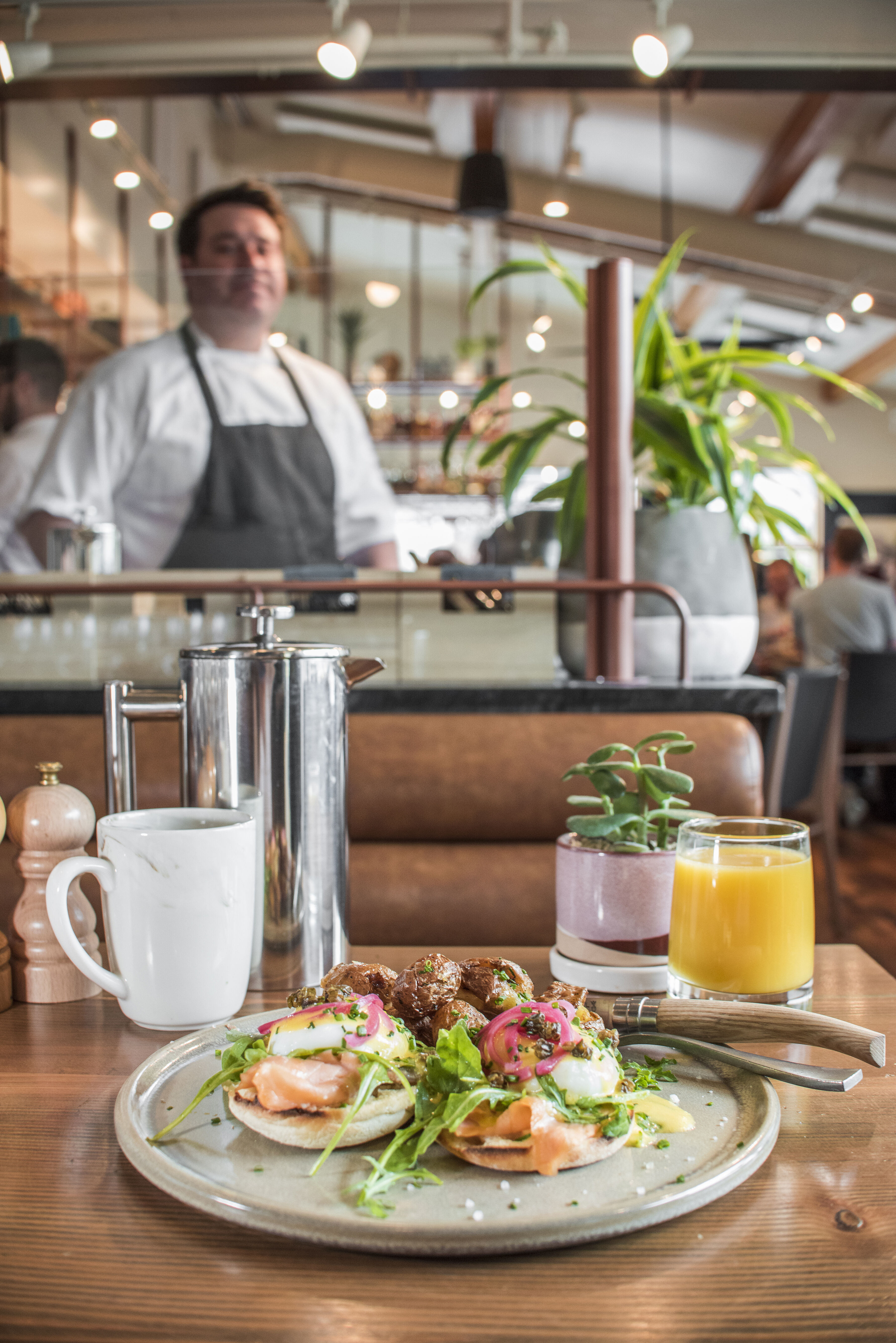 Smoked salmon eggs benedict, coffee, and orange juice at The Bison, a restaurant in the town of Banff.