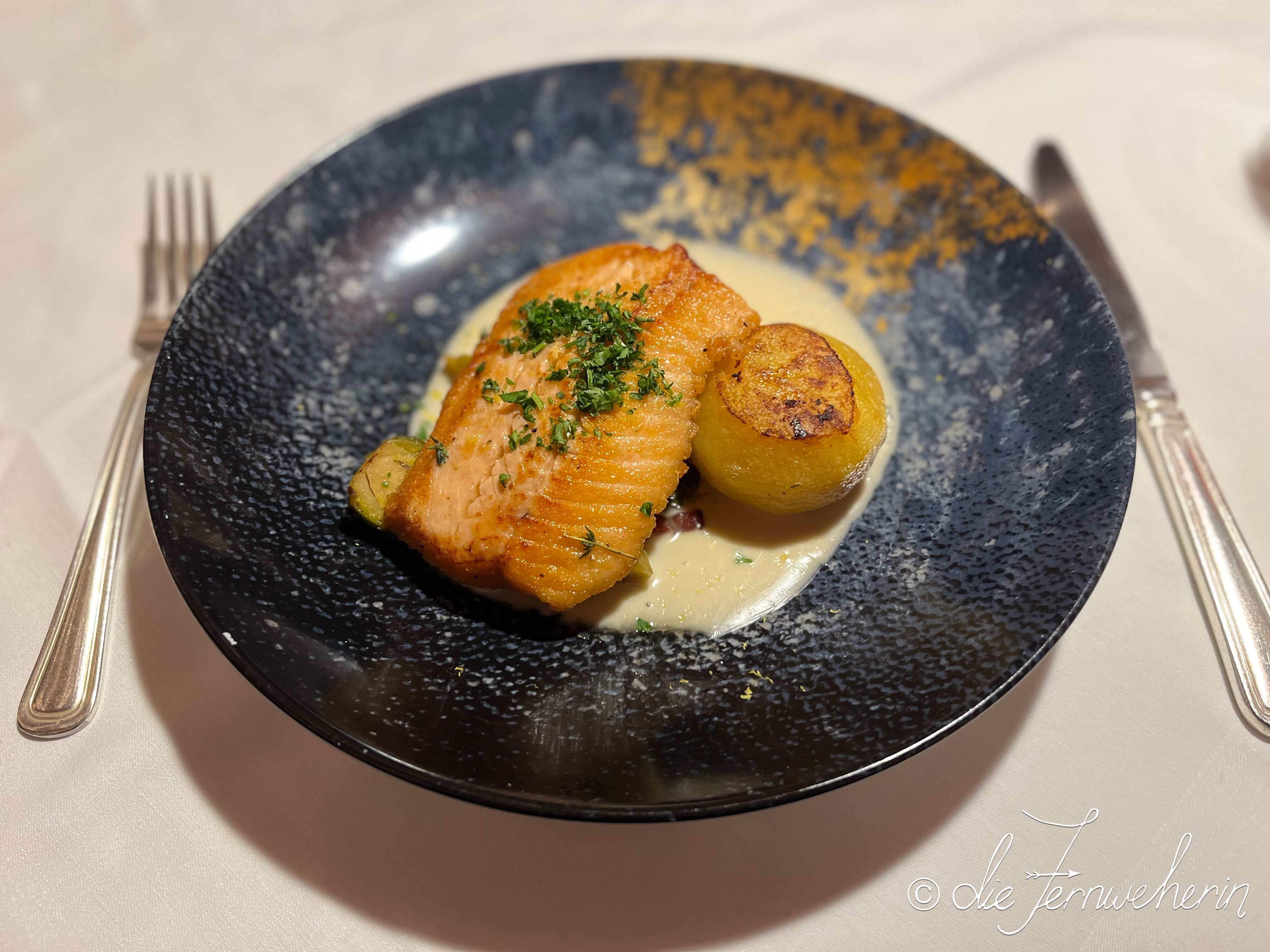 The pan-seared fillet of Alberta Rainbow Trout à la Zug (atop a white wine cream sauce, with brussels sprouts & pommes fondant) at The Post Hotel Lake Louise in Banff National Park.